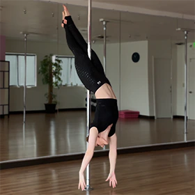 Photo of the pole dance move Cross Ankle Release